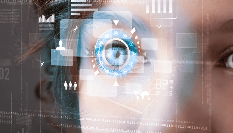 Close-up of an eye with a holographic data interface
